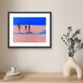 Pure Joy by Louise Turnbull displayed in a black frame with white mount above a wooden console table with eucalyptus.