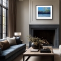 Majestic Sky giclée print by Louise Turnbull displayed in a black frame above a dark fireplace in an elegant living room.