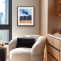Clearing woodland landscape giclée print displayed in a framed arrangement beside an armchair in a contemporary living room