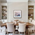 Gold Threads contemporary still life giclée print shown in a wooden frame above a dining table in a bright, neutral dining room